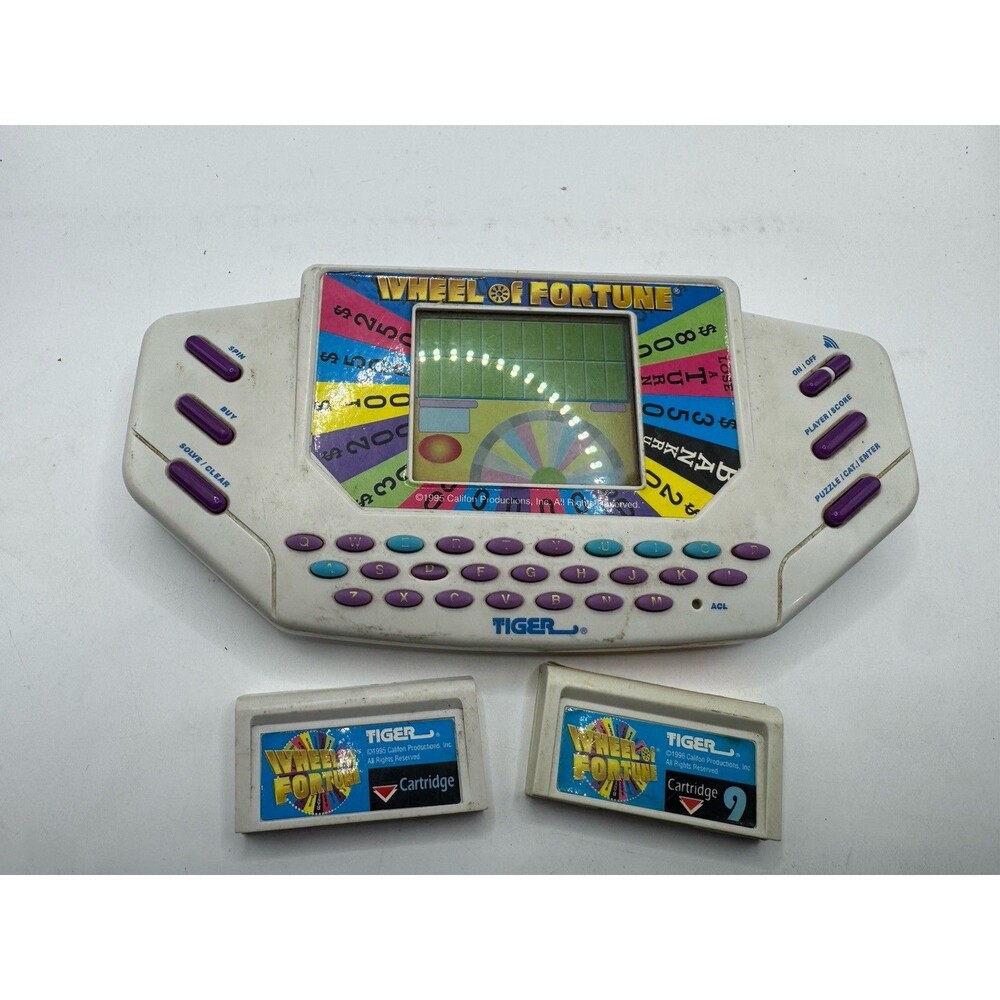 Tiger Electronics Wheel of Fortune Handheld Electronic game for parts or repair